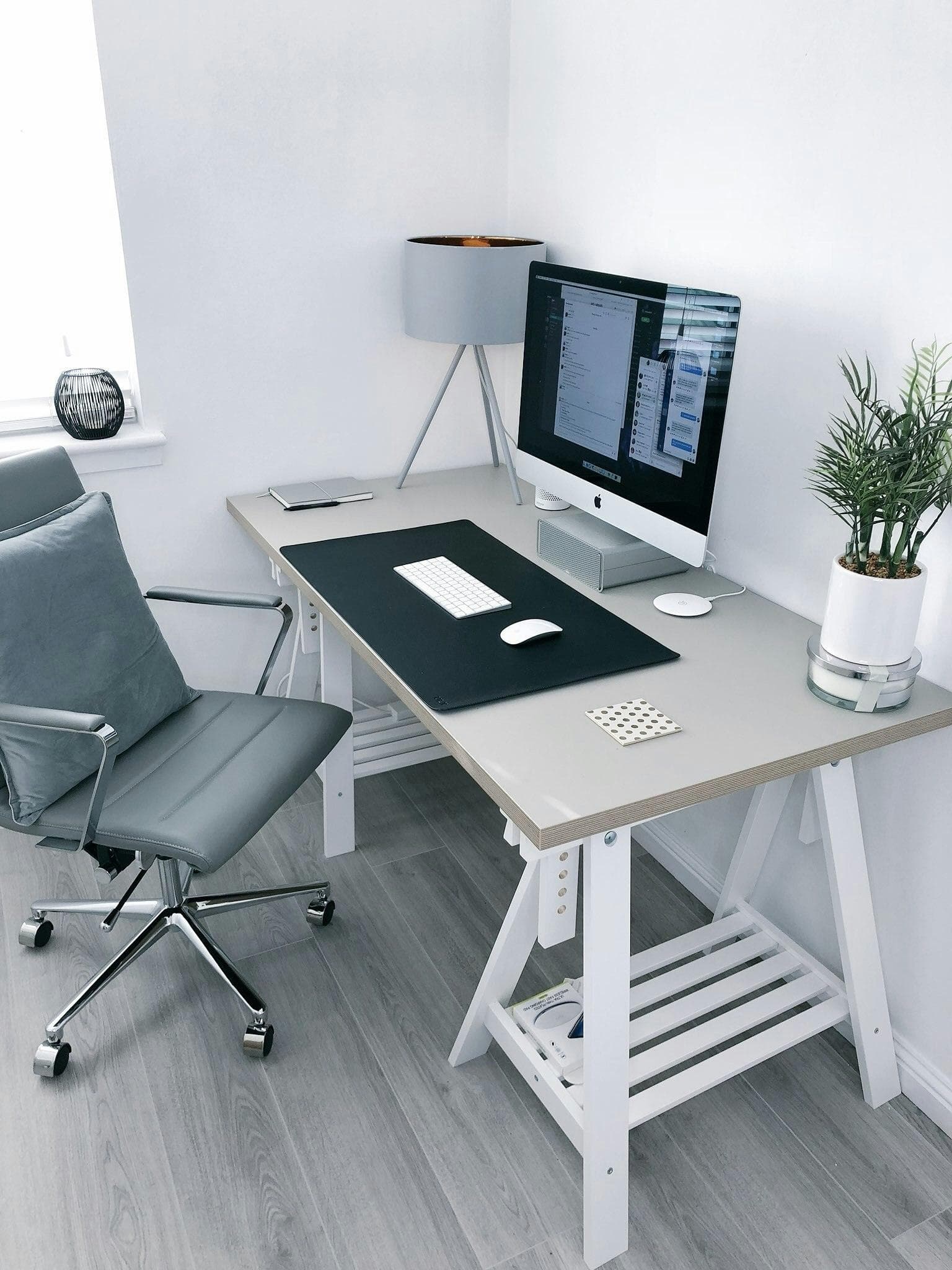 Bright desk setup with an office chair and a desktop computer