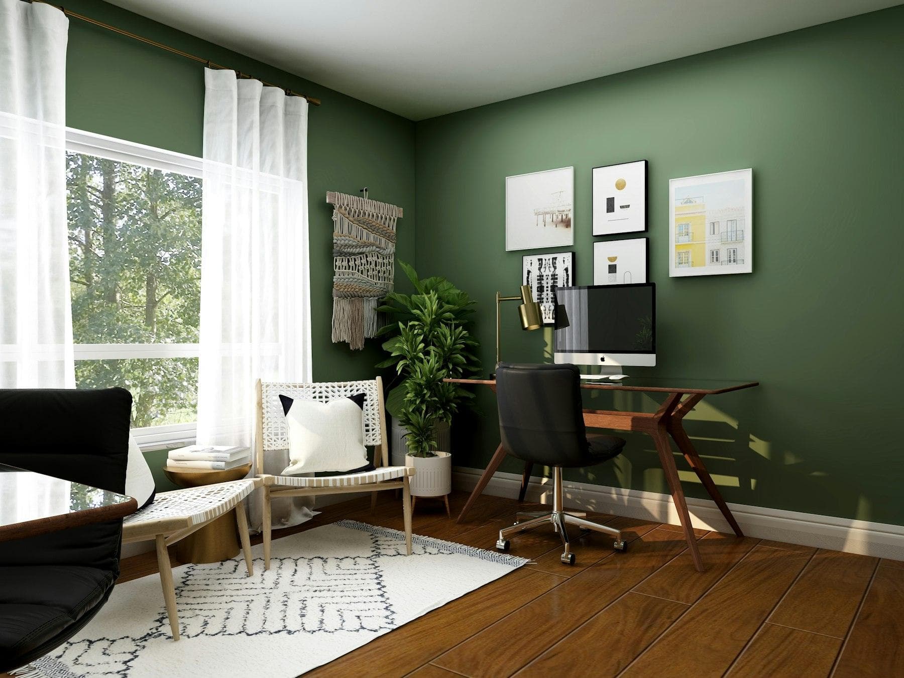Home office with a green wall, desk and armchair